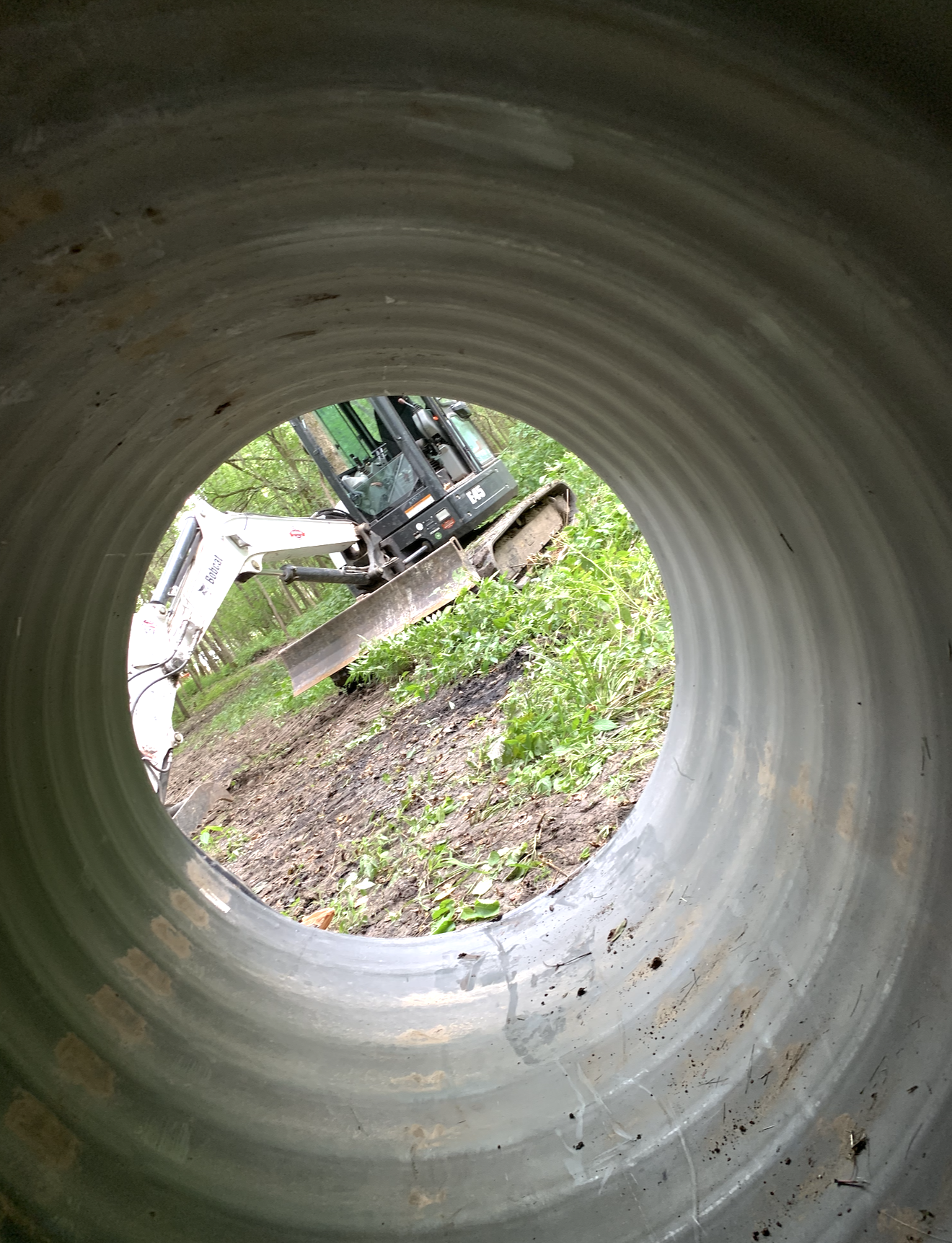 looking out from inside culvert pipe