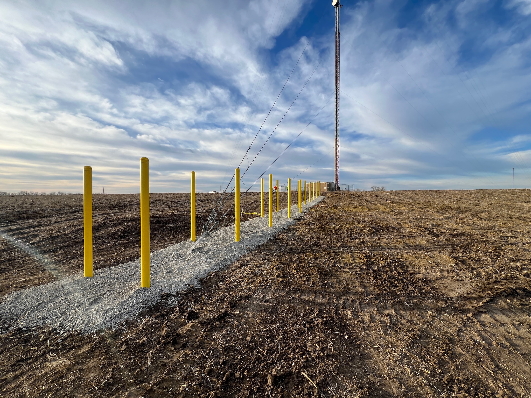 Cell tower with rows of bollards